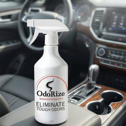 A white spray bottle of OdorRize Odor Eliminator placed on the center console of a modern car interior.